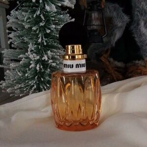 Miu Miu Orange Glass Perfume with Gold and Black Cap